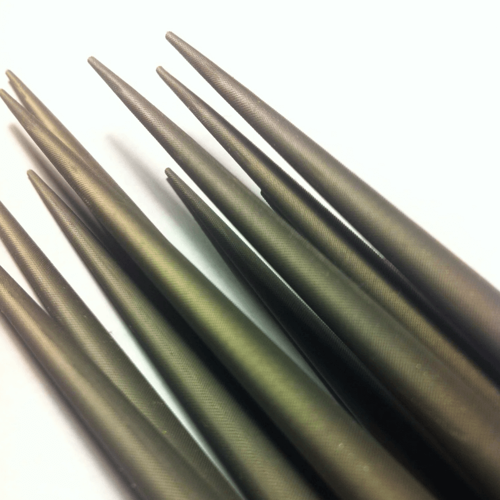 Selection of Swiss No 4 Impressioning file tips detail on a white background