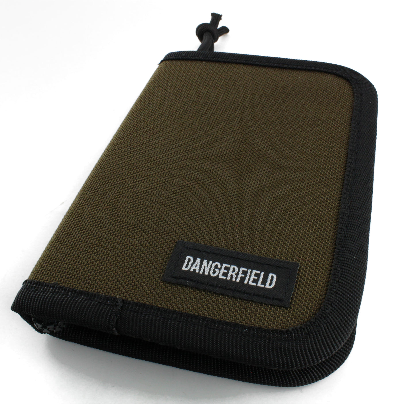 Dangerfield Jackal lock pick case closed at an angle, tan fabric with black binding and a woven Dangerfield label