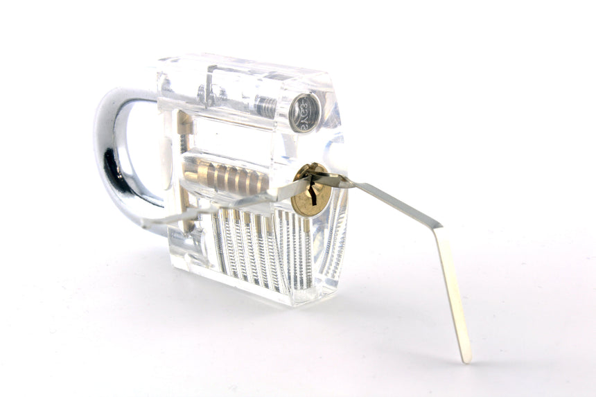 Soho lock rakes inserted into a transparent practice lock on a white background