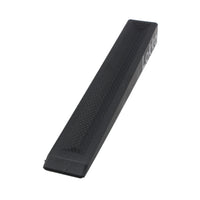 A black textured plastic wedge with a textured surface and a small white printed brand mark, shown on a plain white background.