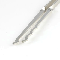 Close-up of a both Bogota lock rakes with a white background