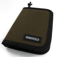 Dangerfield Jackal lock pick case closed at an angle, tan fabric with black binding and a woven Dangerfield label