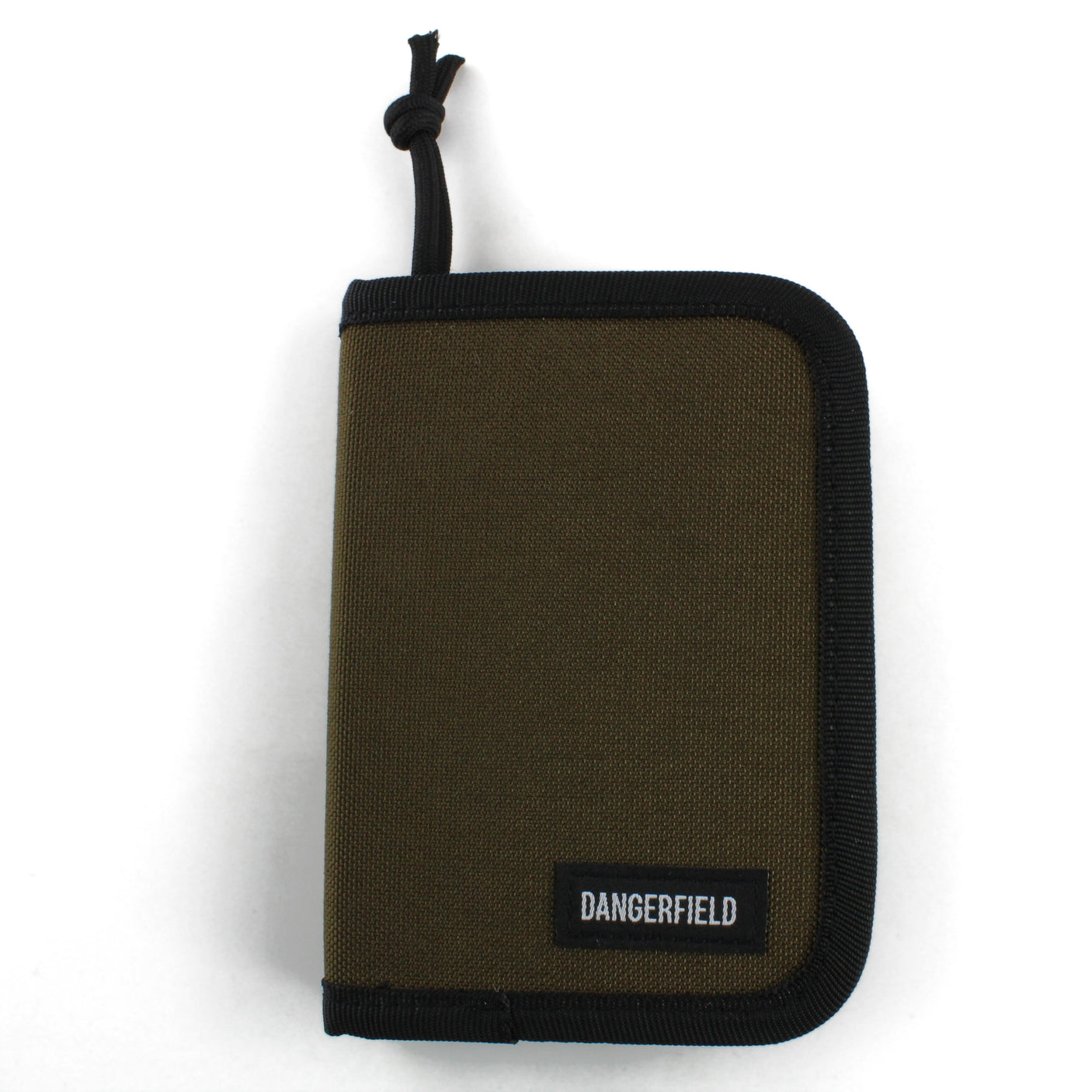 Dangerfield Jackal lock pick case closed, tan fabric front with black webbing binding and a woven Dangerfield label
