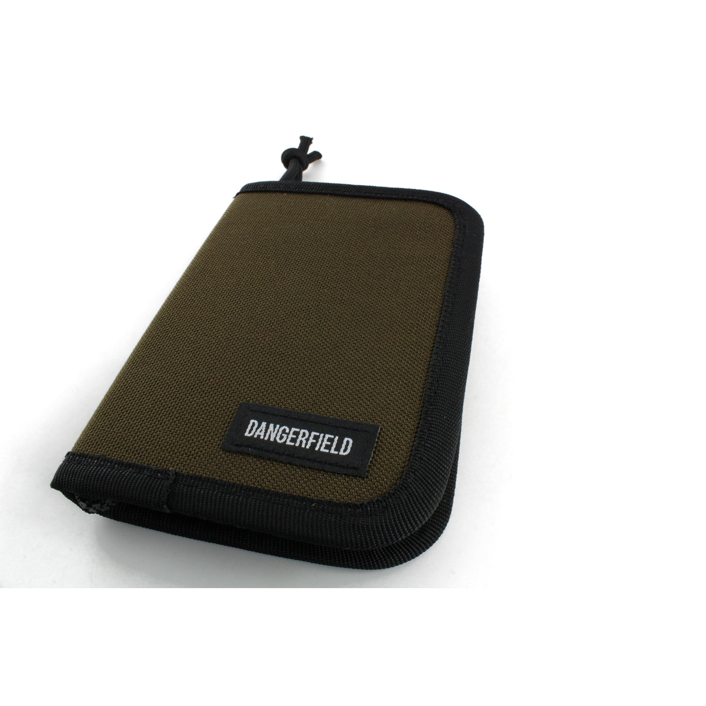 Dangerfield Jackal lock pick case closed at an angle, showing the 2.5 cm spine and the black paracord zip pull