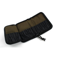 Dangerfield Jackal lock pick case open flat and empty, both inner faces visible with the tan backing and black pocket fabric