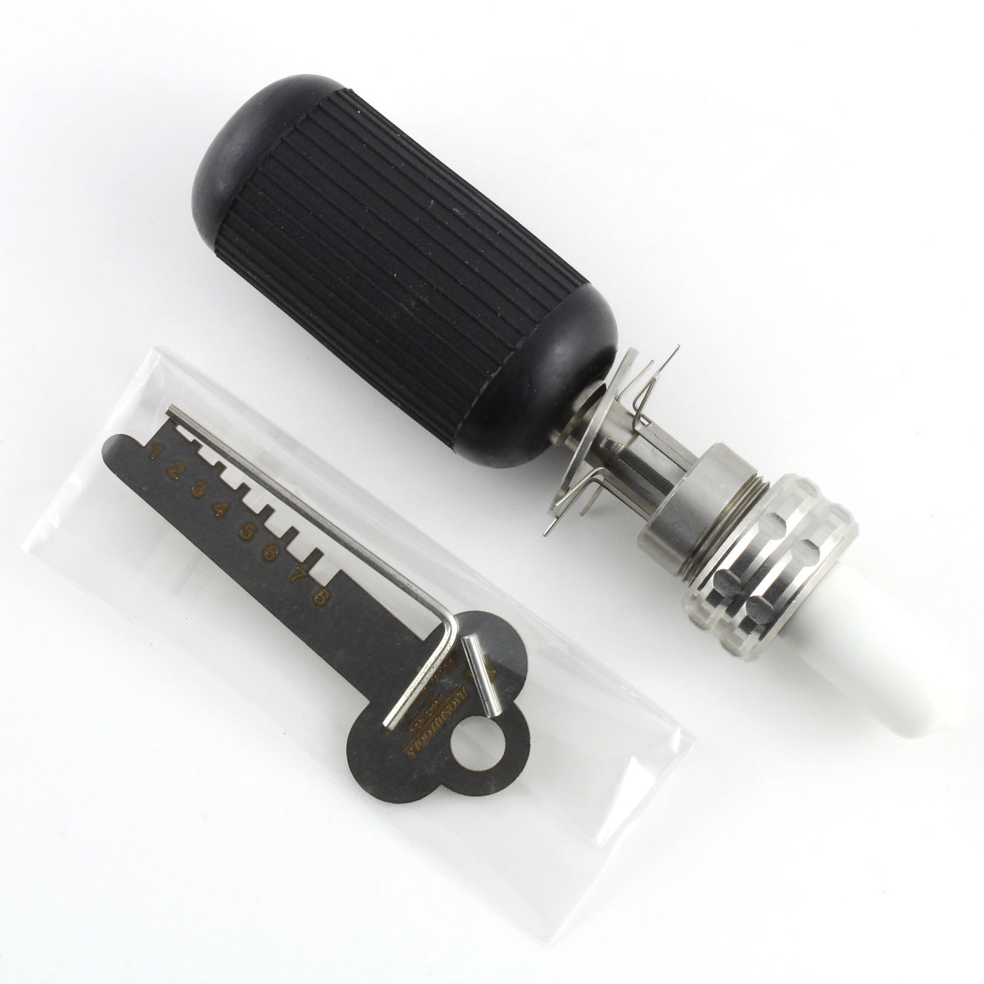 Lokko 7-pin tubular lock pick with textured grip handle beside its numbered decoder key on a dark background