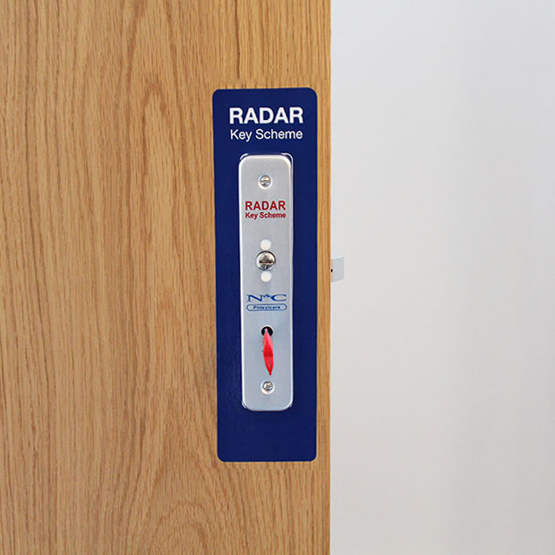 Radar Key Scheme lock on wooden door for disabled toilet access.