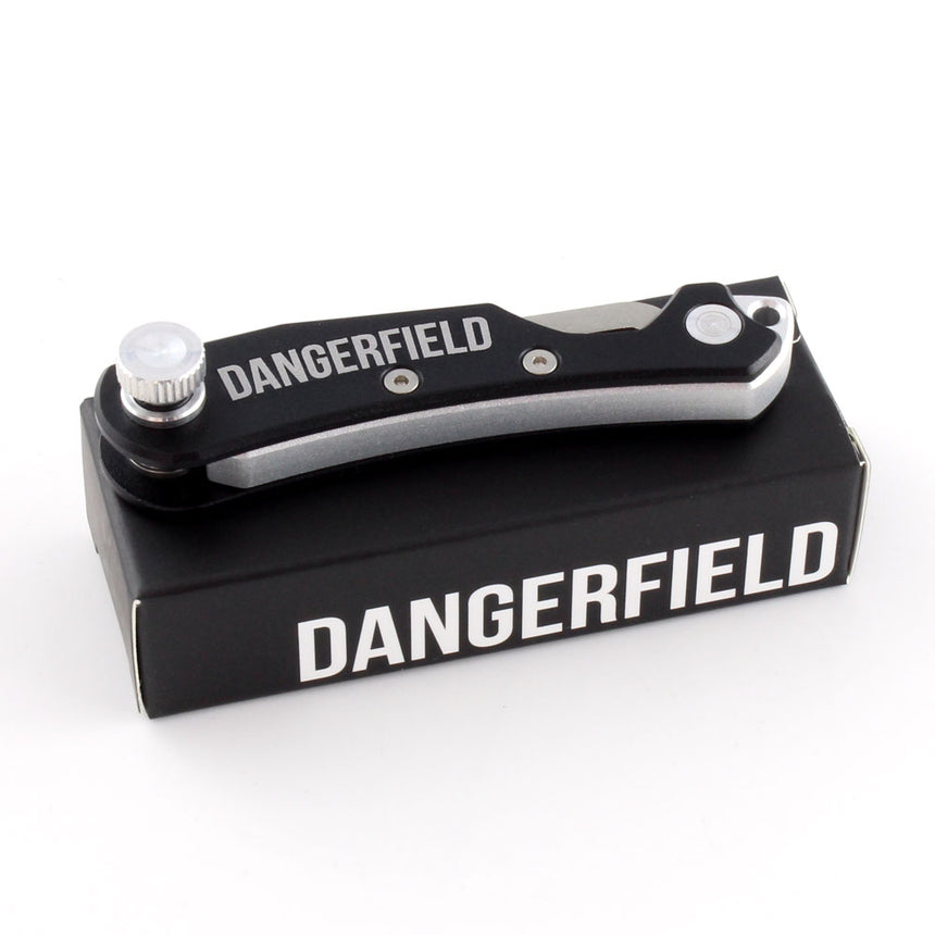 Dangerfield Skeleton Lock Pick EDC Covert Entry Multi-Tool on packaging, made of aerospace-grade aluminum and stainless steel.